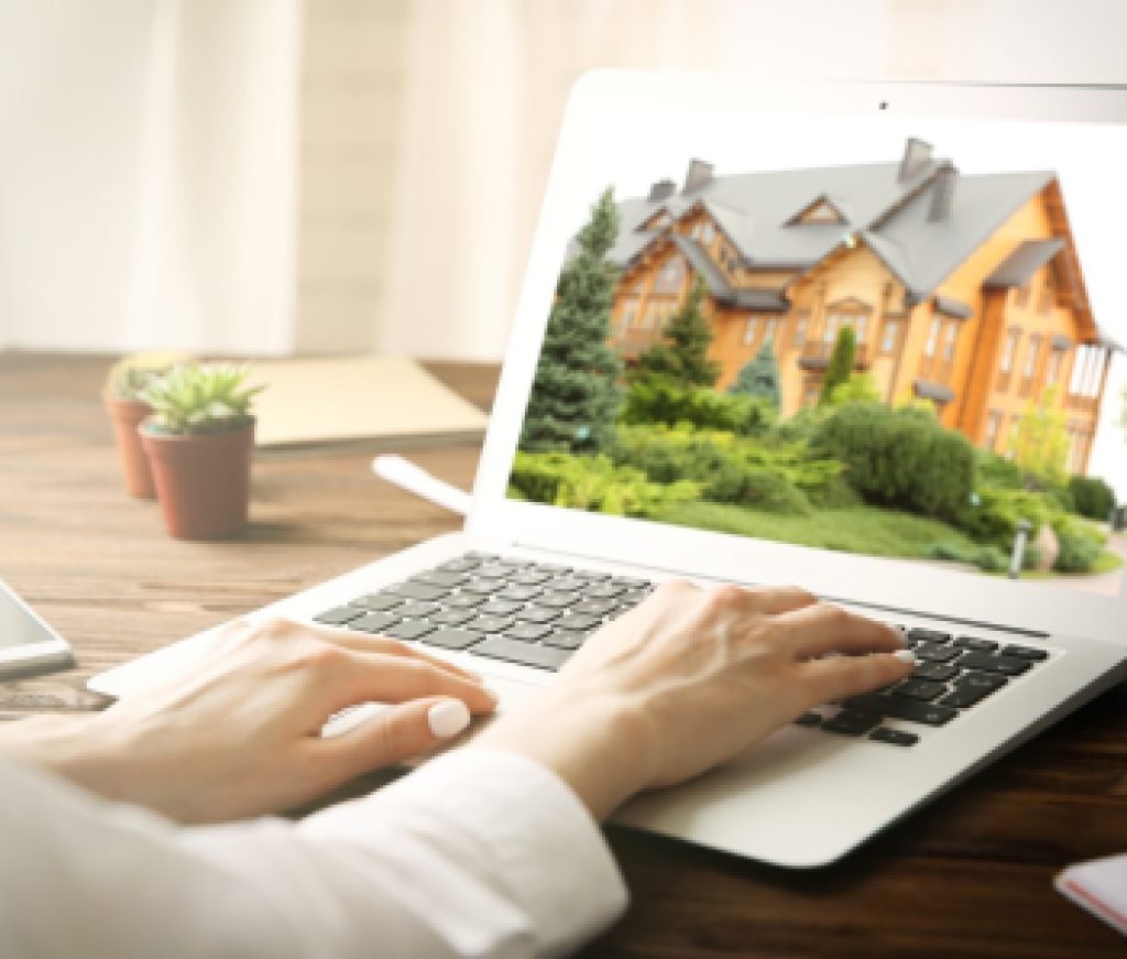 Online shopping concept. Woman looking for house on real estate market website