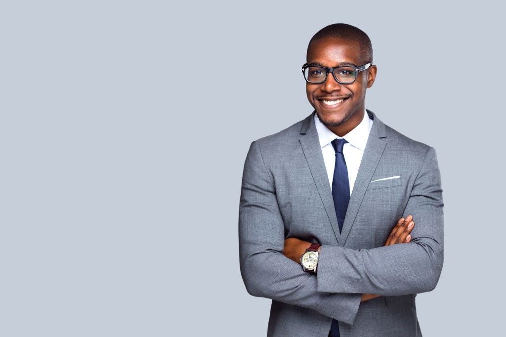 Friendly isolated portrait of african american business man, sales, representative