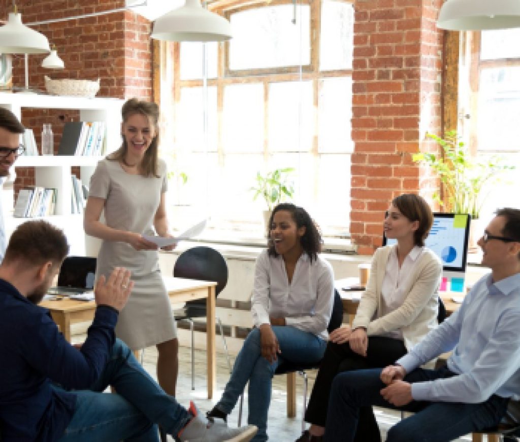 Happy friendly business team having fun at corporate training