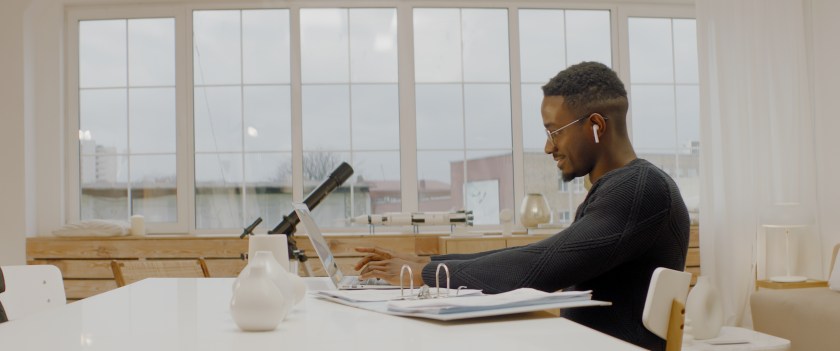 African American male remote working from home, having work confrence video call
