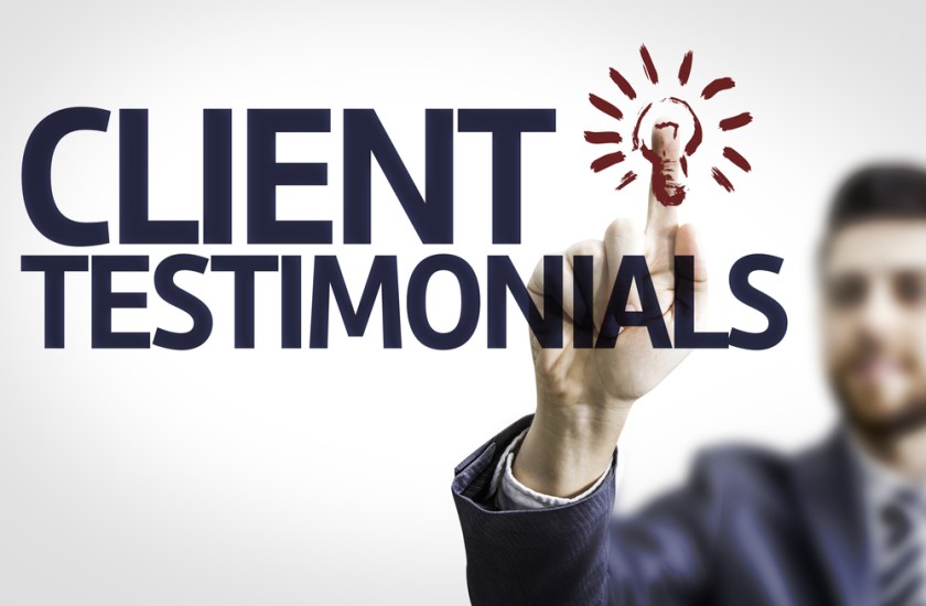 Business-man-pointing-to-transparent-board-with-text-Client-Testimonials