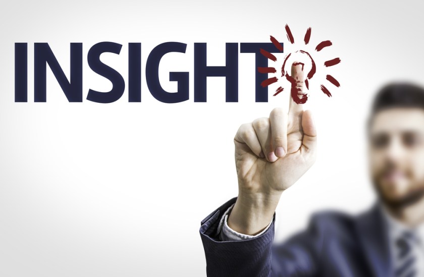 Business-man-pointing-to-transparent-board-with-text-Insight