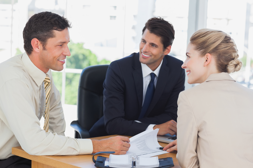 Business-people-smiling-during-a-meeting-in-the-office