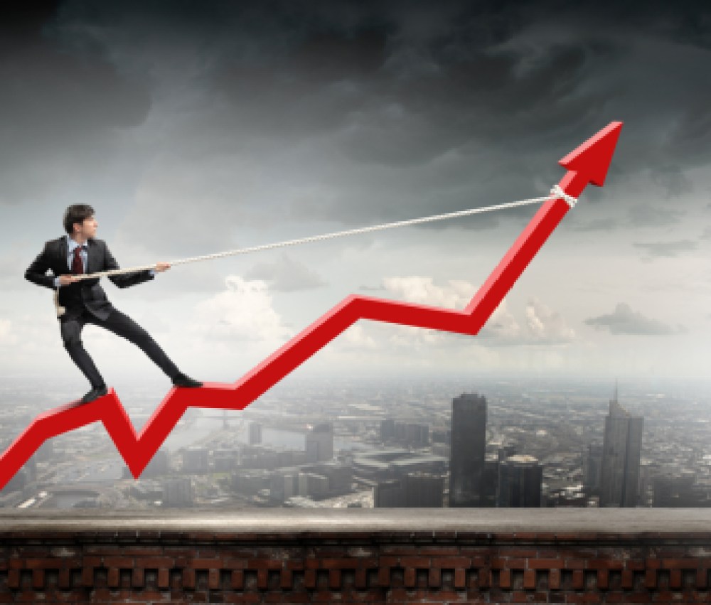 Businessman-pulling-arrow-with-rope-and-making-it-raise-up
