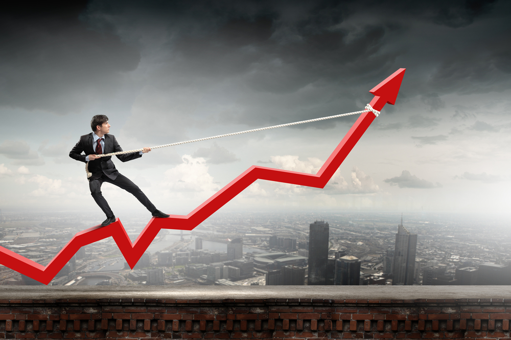 Businessman-pulling-arrow-with-rope-and-making-it-raise-up