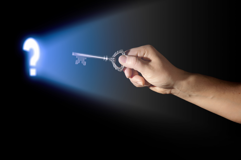Close-up-of-human-hand-holding-key.-Idea-concept