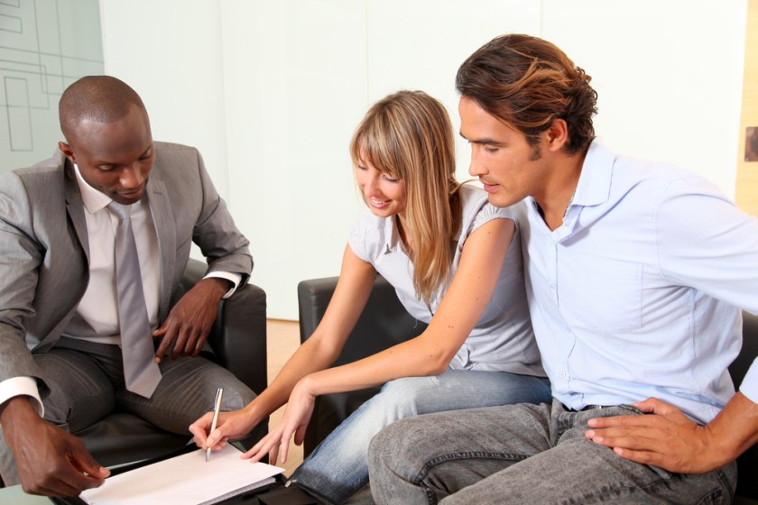 Couple-signing-home-purchase-contract