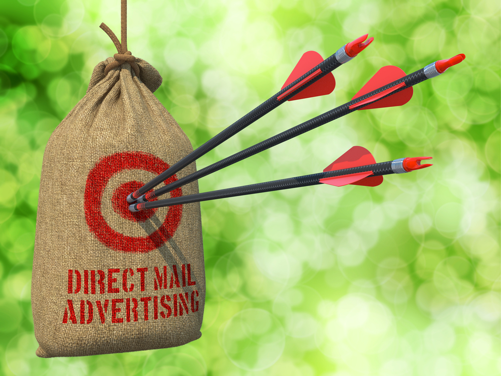 Direct-Mail-Advertising-Three-Arrows-Hit-in-Red-Target-on-a-Hanging-Sack-on-Natural-Bokeh-Background.
