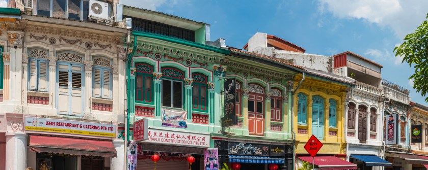 Colourful buildings shop and shutters panorama Little India Singapore