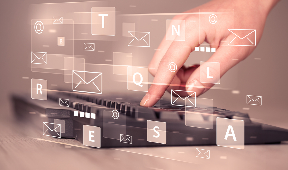Hand-typing-on-keyboard-with-digital-tech-icons-and-symbols