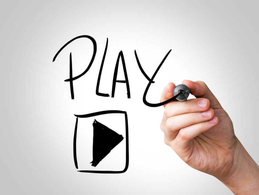 Hand-writing-with-a-black-mark-on-a-transparent-wipe-board-Play
