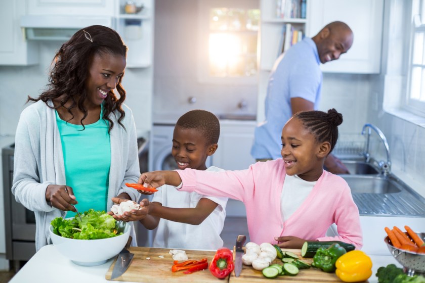 Happy-family-preparing-food-in-kitchen