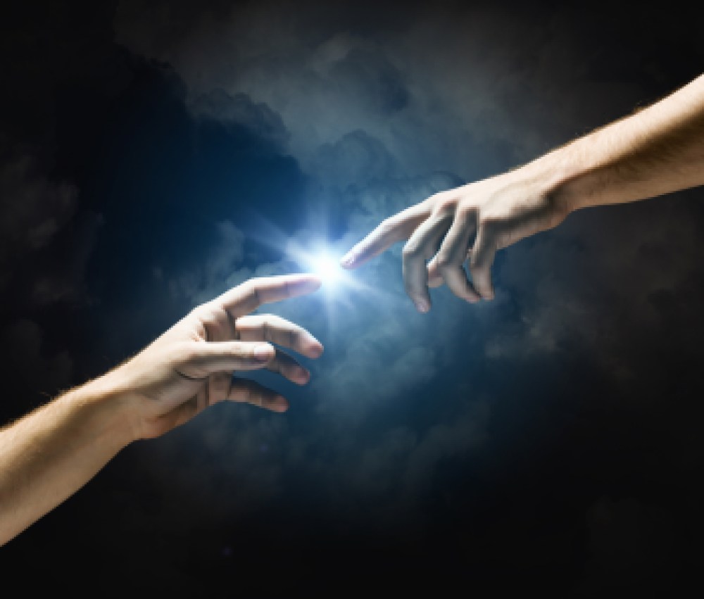 Michelangelo-Gods-touch.-Close-up-of-human-hands-touching-with-fingers