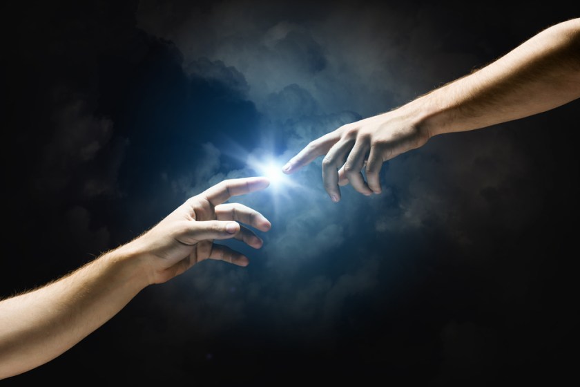 Michelangelo-Gods-touch.-Close-up-of-human-hands-touching-with-fingers
