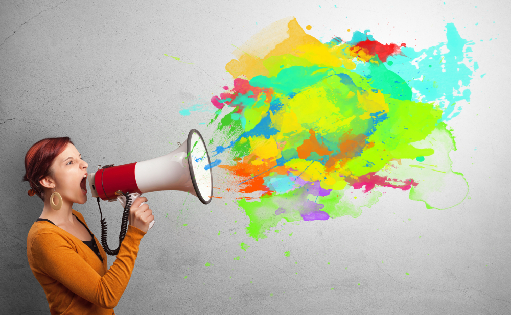 Person-with-megaphone-and-colorful-splashes