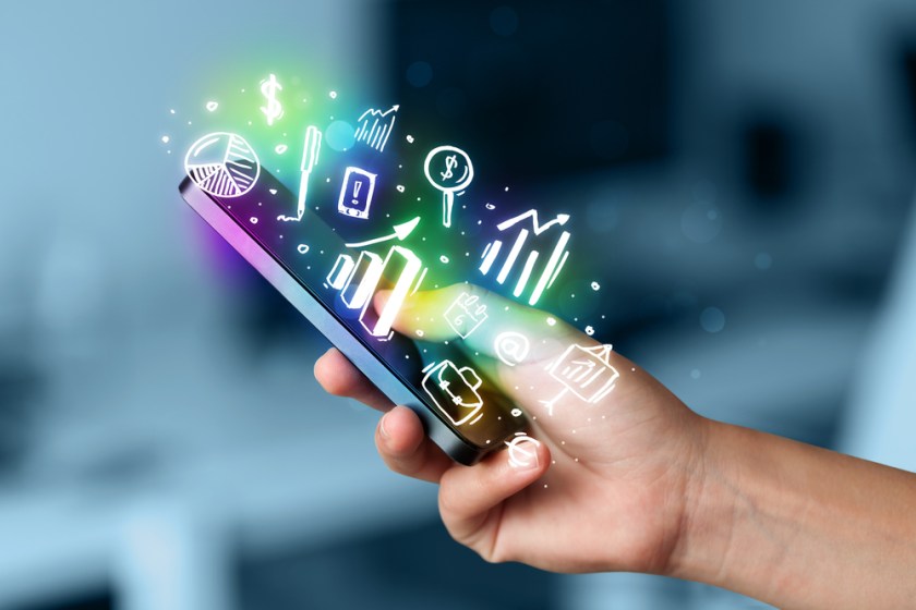 Smartphone-with-finance-and-market-icons-and-symbols-concept