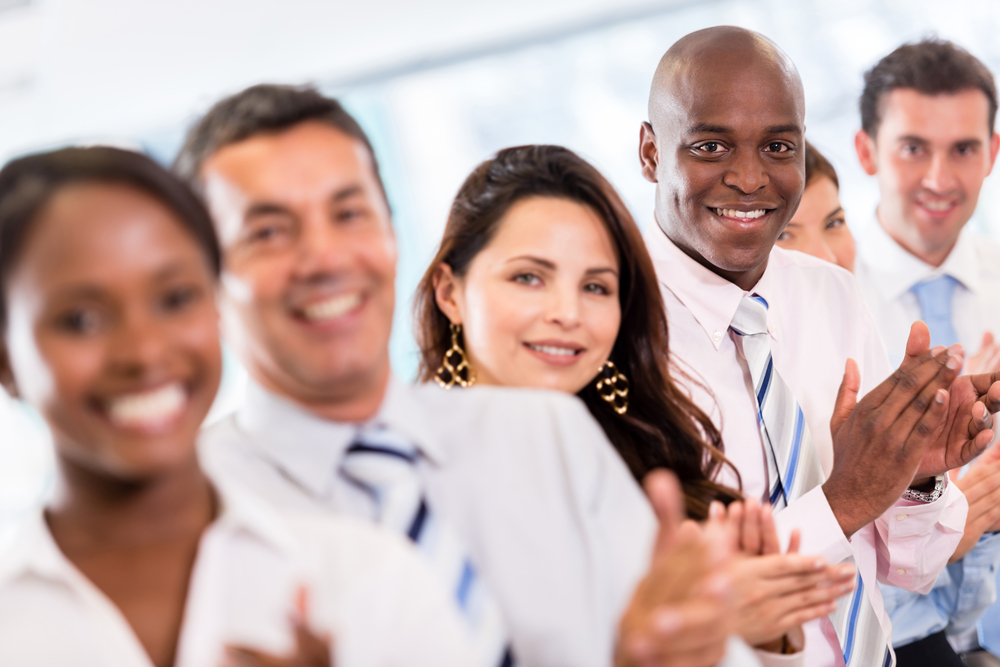 Successful-business-group-applauding-after-a-presentation