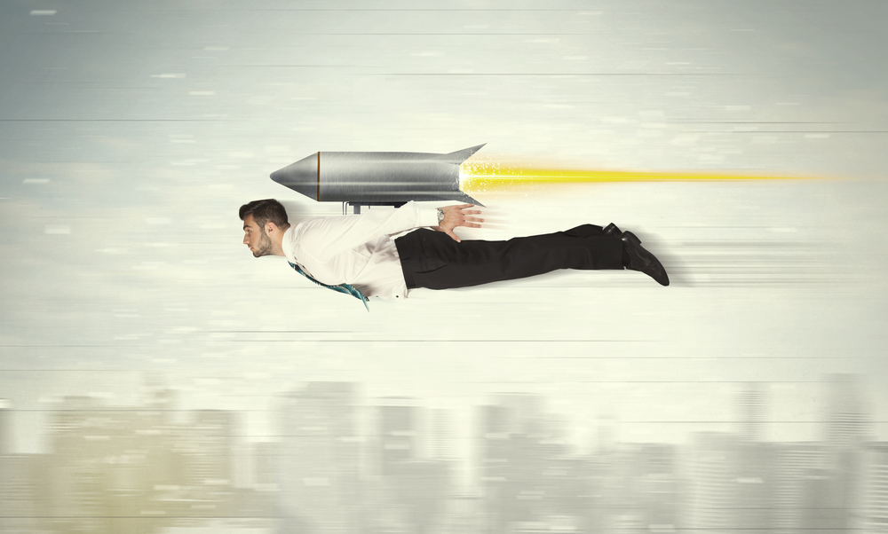 Superhero-business-man-flying-with-jet-pack-rocket-above-the-city-concept