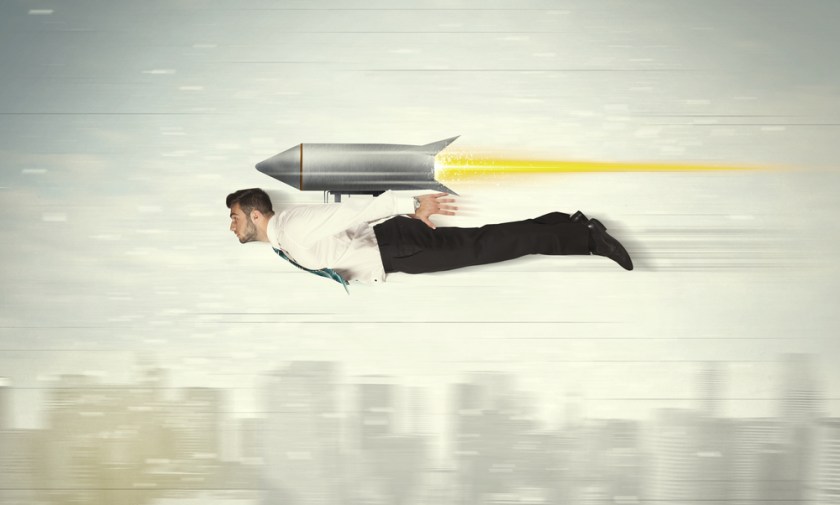 Superhero-business-man-flying-with-jet-pack-rocket-above-the-city-concept