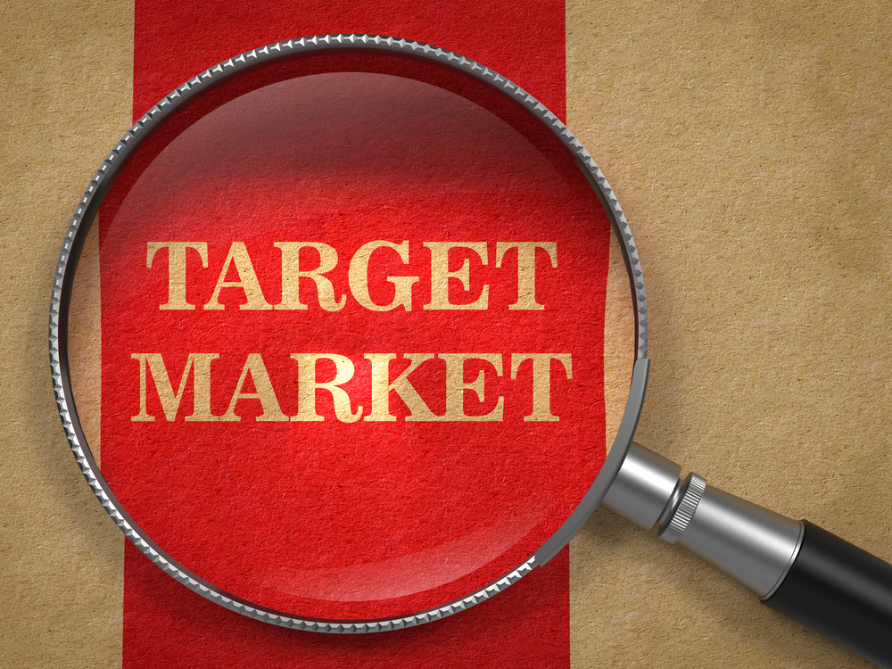 Target-Market-Magnifying-Glass-on-Old-Paper-with-Red-Vertical-Line.