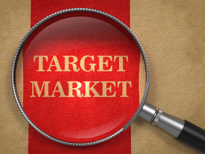 Target-Market-Magnifying-Glass-on-Old-Paper-with-Red-Vertical-Line.