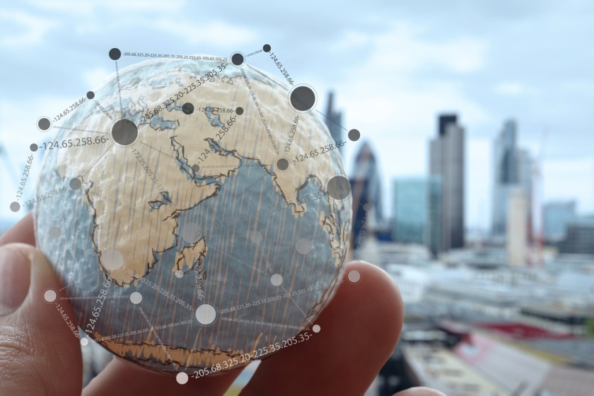close-up-of-businessman-hand-showing-texture-the-world-with-digital-social-media-network-diagram-concept-Elements-of-this-image-furnished-by-NASA-london-city-background