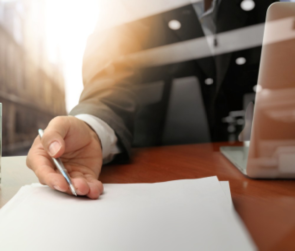 double-exposure-of-businessman-or-salesman-handing-over-a-contract-on-wooden-desk-1