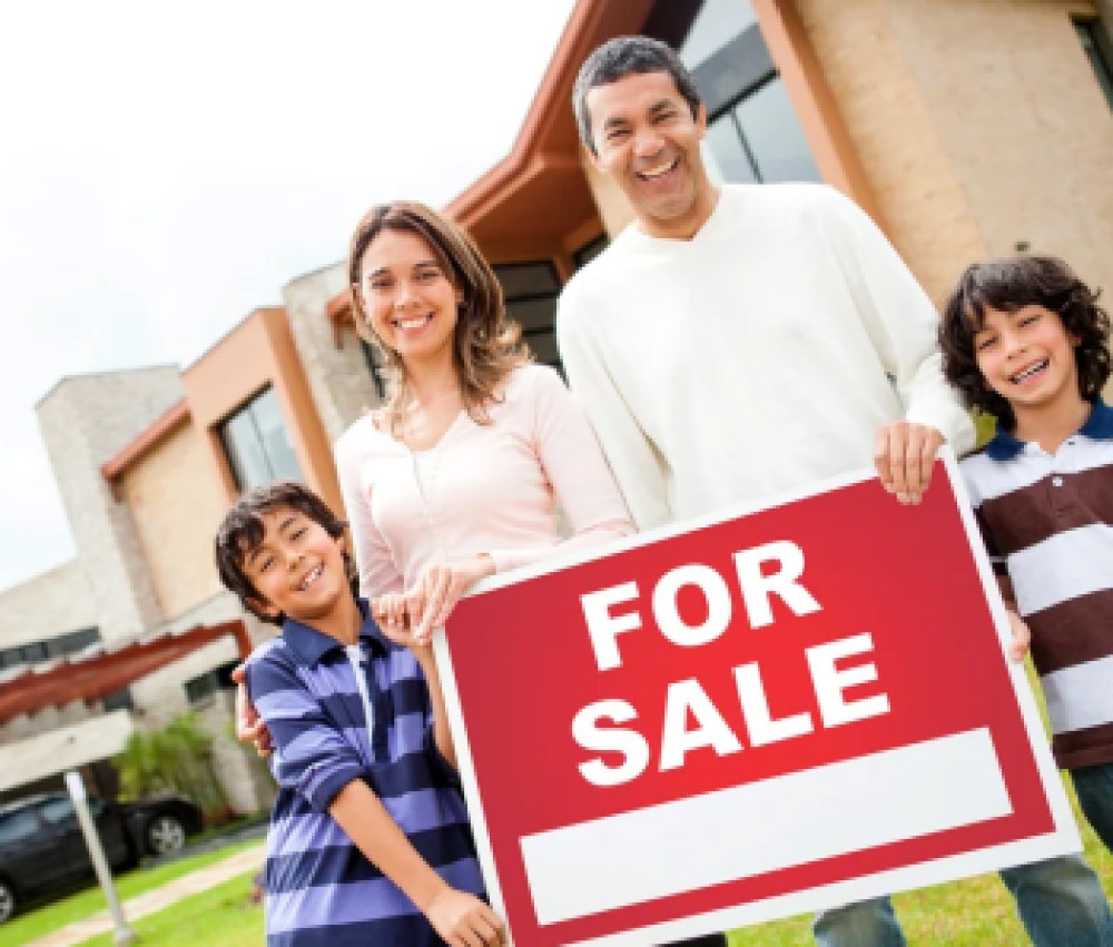 Family-holding-sign