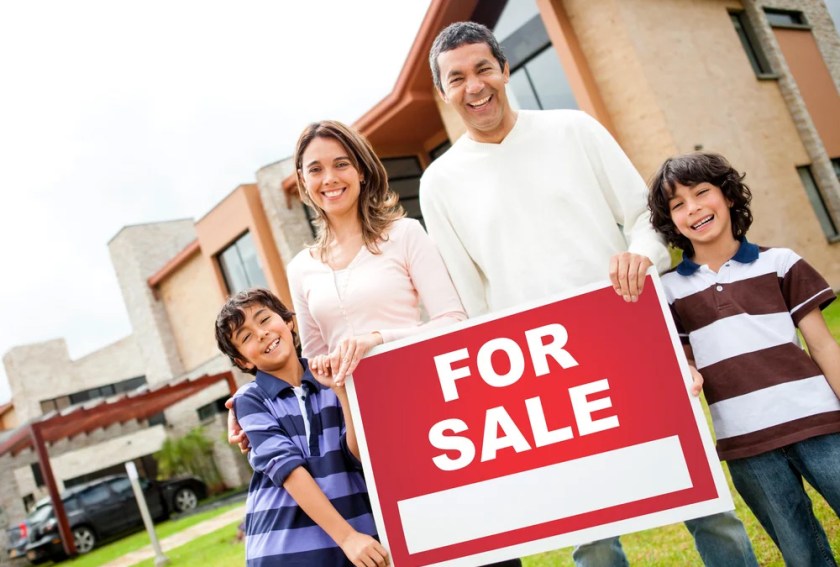 Family-holding-sign