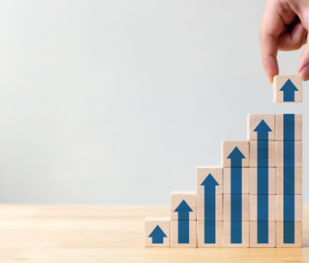 Ladder career path for business growth success process concept.Hand arranging wood block stacking as step stair with arrow up
