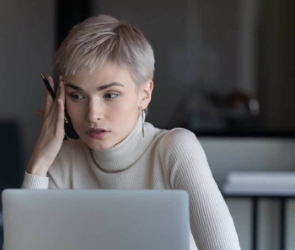 Businesswoman sitting at workplace search solution having problem feels confused