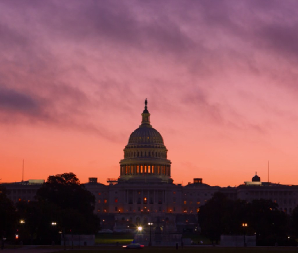 Alarmingly bright sunrise above US Capitol Dome. U.S. Capitol Dome Restoration project is nearing its completion.