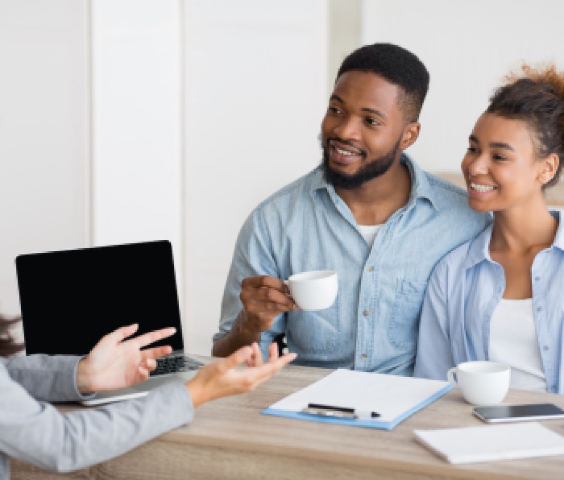 Afro Couple Attending Home Buying Consultation In Real Estate Agency