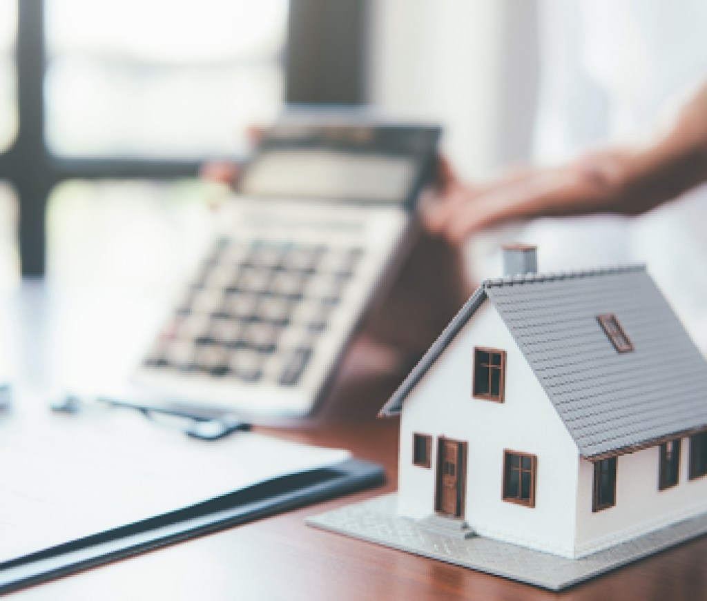 House model with real estate agent and customer discussing for contract to buy house, insurance or loan real estate background.