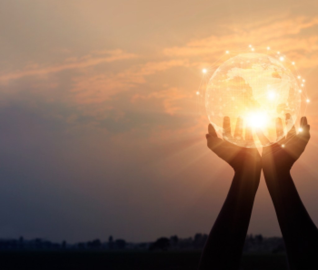 Abstract networking. Technology and communication. Hands holding global network and data exchanges on sunset background.