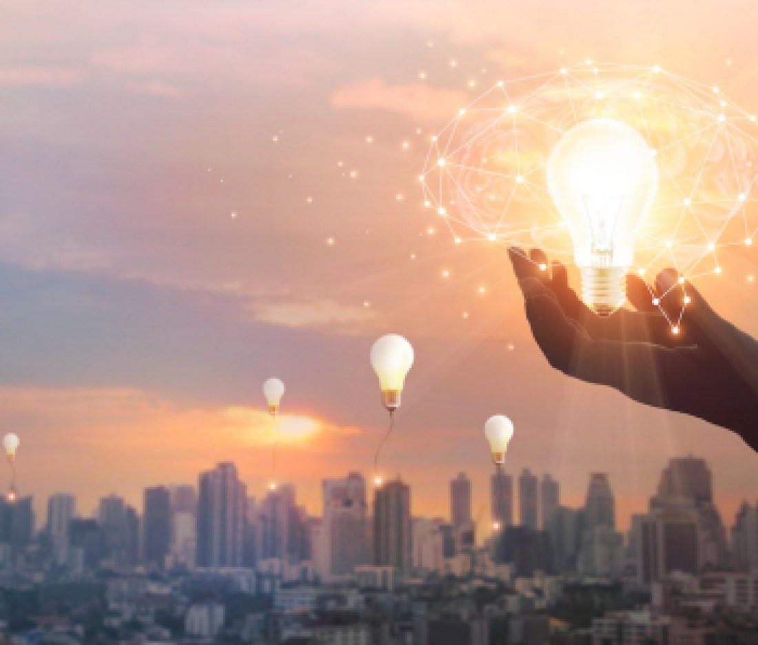 Hand holding light bulb and brain and network connection on city background, Idea and imagination, Creative and inspiration. Innovation future and technology.