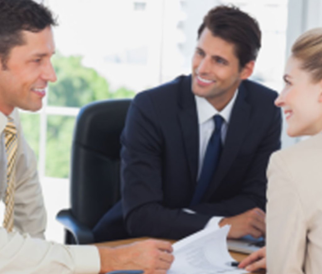 Business-people-smiling-during-a-meeting-in-the-office