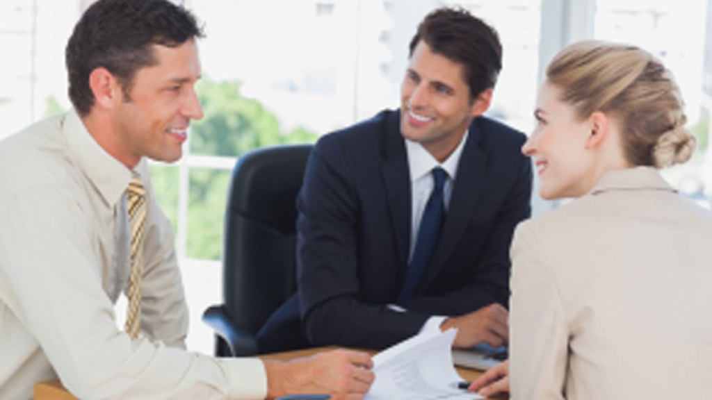 Business-people-smiling-during-a-meeting-in-the-office