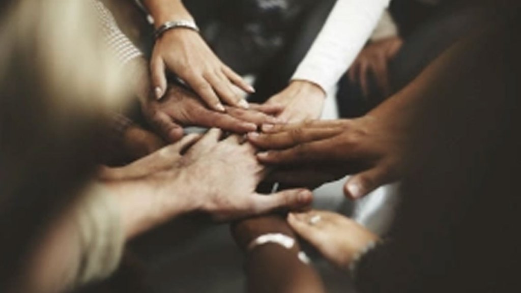 Team-hand-huddle