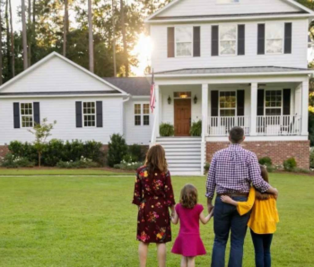 Family in front of home